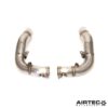 By removing the original restrictive catalytic converters located within the factory OEM downpipes