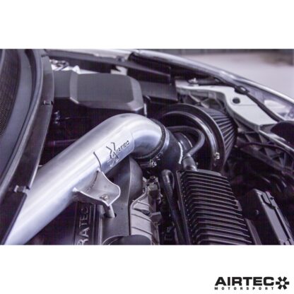 it is offered in either Motorsport brushed silver or powder coated black finishes and features a laser cut AIRTEC Motorsport plaque. The comprehensive kit also includes a Pro Hoses silicone connector and all fixtures and fittings