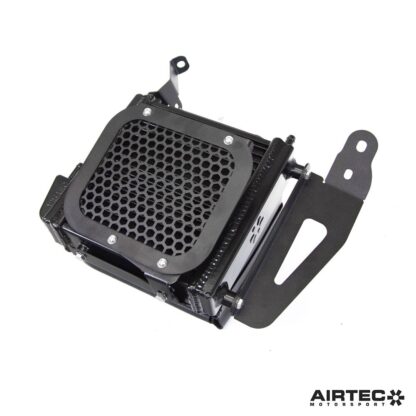 air then exits via the inner arch liner (requires cutting). A pre-cut mesh shield is supplied for both the front and rear to protect the radiator from road debris damage.The radiator is plumbed directly into the existing oil/water heat exchanger system to improve the car's overall capacity and cooling ability