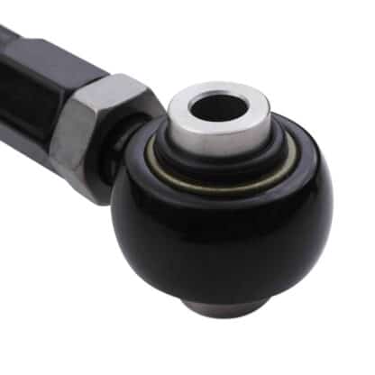 Spherical bearing mounted inner pivot points rather than bushes to reduce static friction and improve suspension performance