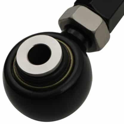Spherical bearing mounted inner pivot points rather than bushes to reduce static friction and improve suspension performance