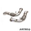 By removing the original restrictive catalytic converters located within the factory OEM downpipes