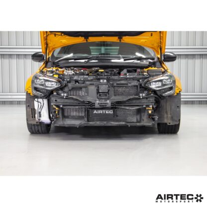 external oil cooler mounted neatly behind the bumper for direct airflow