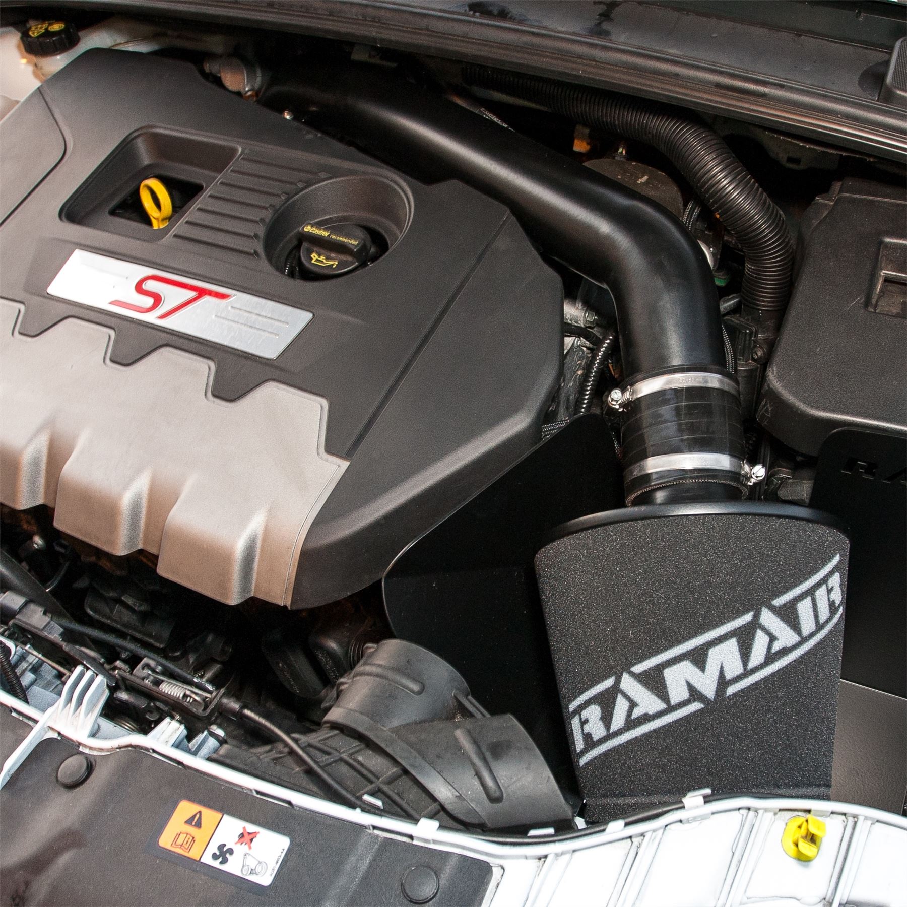This Performance intake kit is designed to fit a MK3 Ford Focus ST 250 2.0T 2014 – 2019 with the twist in style IAT sensor. Other kit available for the bolt type sensor.  Features  Improves performance and throttle response Enhanced induction and turbo sound Full fitting kit and instructions Easy to clean using our filter maintance kit - CK-003  What Does It Do? This performance intake kit allows improved air flow and sound over the standard restrictive factory equipment. What Will I Get? Ramair Filters utilise the top-quality components in all their kits see below for what this kit will include:  Black powder coated heat shield Ramair foam filter Black silicone couplers Black powder coated hard intake pipe Full fitting kit with easy step by step instructions  If you have any queries on this product fitment then please contact us via 01793 296 344 or on our live chat and one of our brand associates will be more than happy to assist.