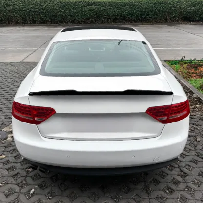 Add style and aerodynamic performance with a Gravity Performance rear spoiler. Transform the look and profile of your Audi