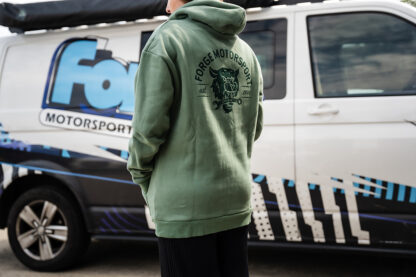 this hoodie not only offers unmatched comfort but also embodies the fierce determination of those who aren't afraid to get their hands dirty. The deep green colour is a nod to classic racing heritage