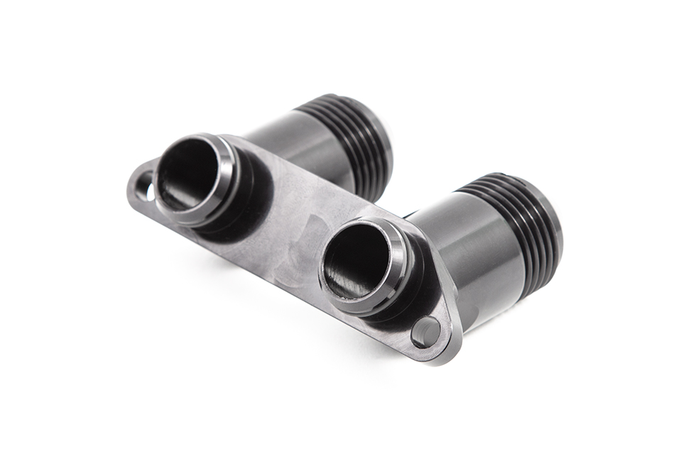 <p>This Oil Cooler Manifold replaces the OEM part to allow the installation of an aftermarket oil cooler in place of the cooler that comes from the factory. Our Oil Cooler Manifold is machined from 6082 billet aluminium and then anodised black to prevent any possibility of corrosion. The manifold has two AN-12 fittings to allow you to add your own braided&nbsp;lines to suit your specific needs.</p>