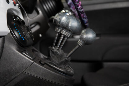 you can set the shifter throw to your driving preference anywhere between standard and a maximum reduction of<strong><em> 73</em></strong><strong><em>% per gear shift.&nbsp;</em></strong></p>