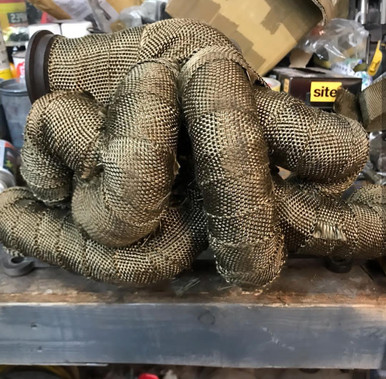 reaching temperatures up to 1200 degrees in extreme cases. A hot manifold and exhaust system can harm engine performance by raising the intake air temperature. Engines perform best at optimal temperatures; cooler intake temperatures produce better performance and more power.