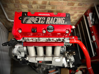 Then they are powder coated in black and placed on the laser engraved to get our signature Exoracing design etched onto the flush spark plug cover.